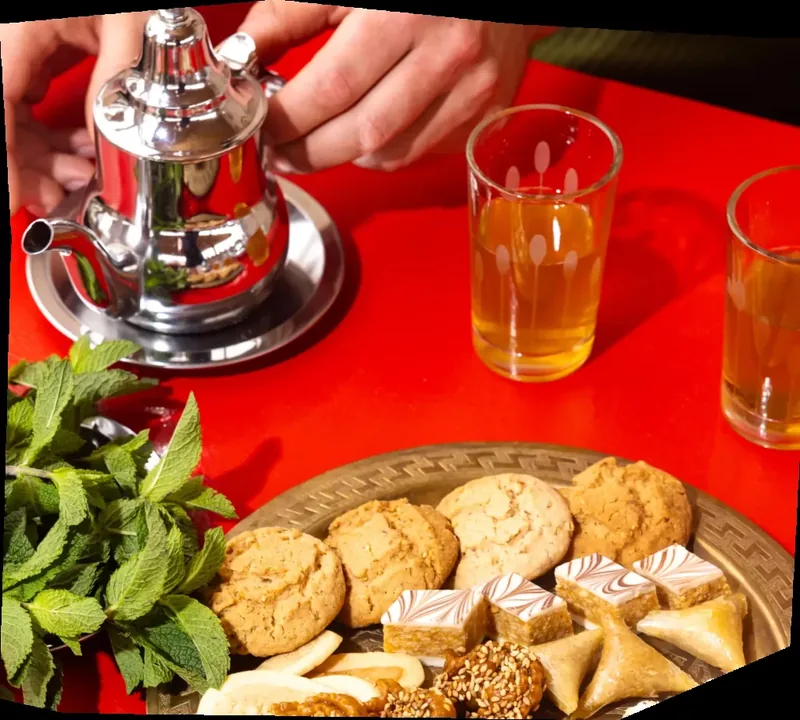 Traditional Moroccan tea poured into glasses in Marrakech
